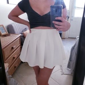 Pleated white mini skirt